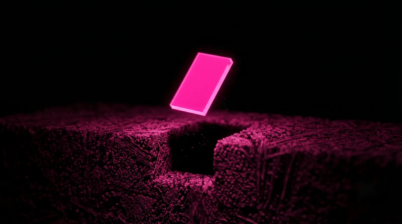 A single glowing hot-pink shard lifted cleanly from a dim block of texture, a clear extractable fact that answer engine optimization rewards