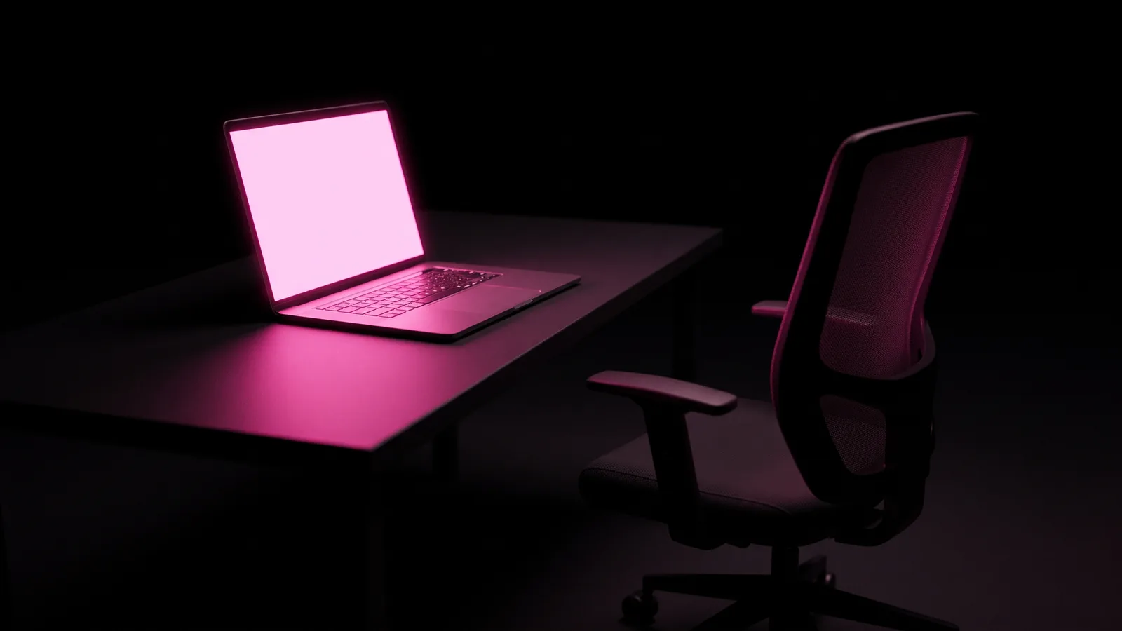 An open laptop on an empty dark desk with its blank screen glowing hot pink and the chair pushed back, a part-time AI role