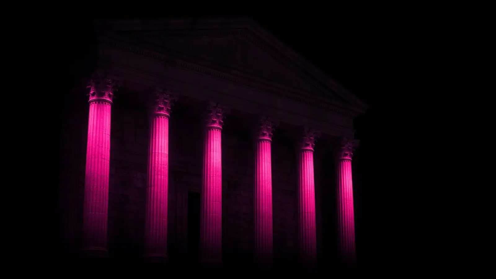 A classical government building facade at night with columns edged in hot pink light, Chapter 30B technology procurement in Massachusetts towns