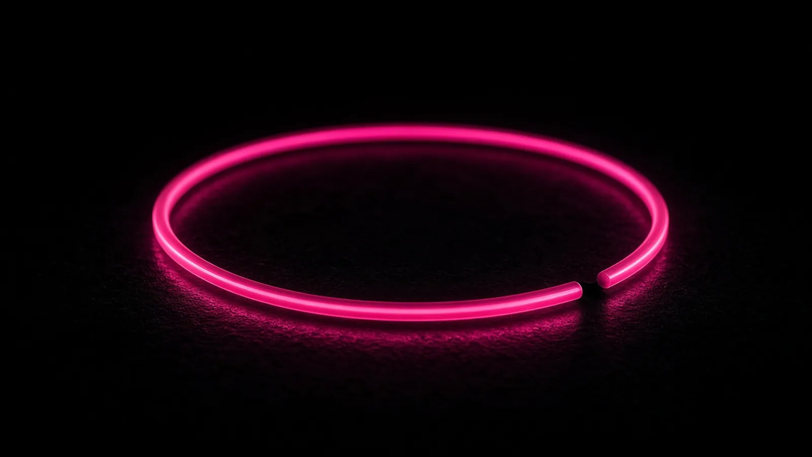 A magenta ring of light leaving one dark segment on black, control scope gaps behind cyber insurance claim denials