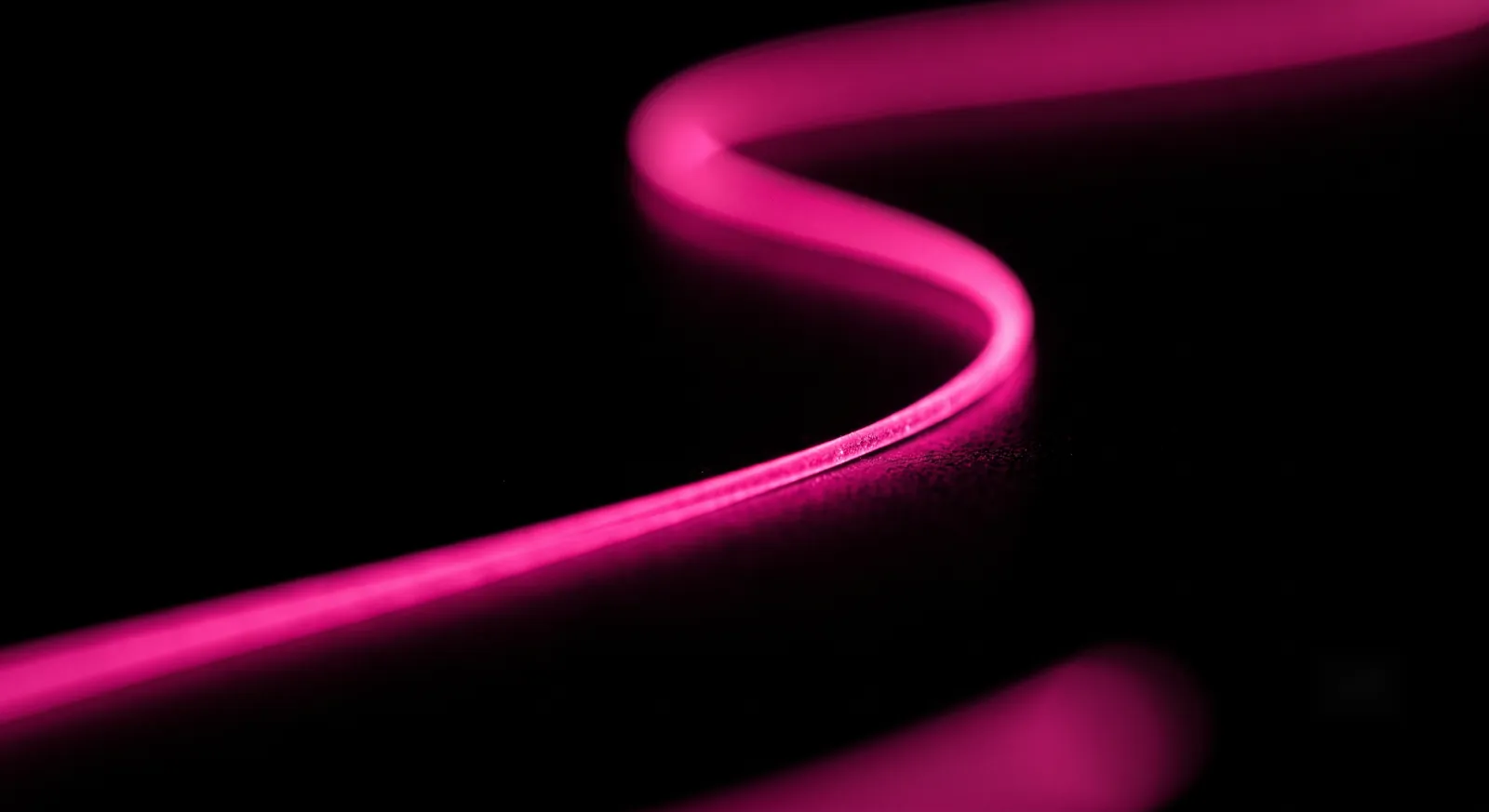 A single connected pathway of light tracing data lineage across a black field