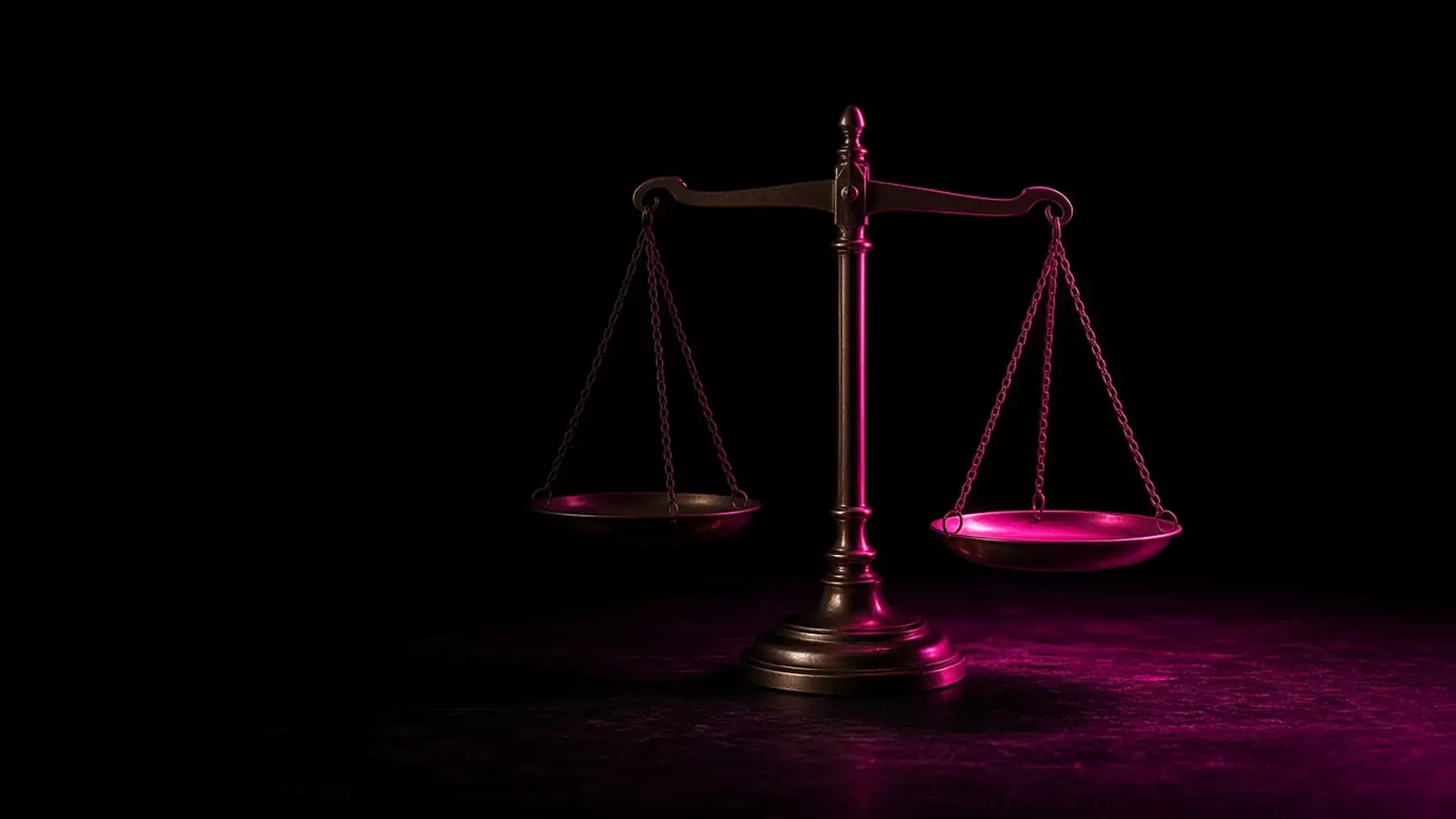 A brass balance scale on a dark desk with one pan lit hot pink, the cost of a data breach in Massachusetts