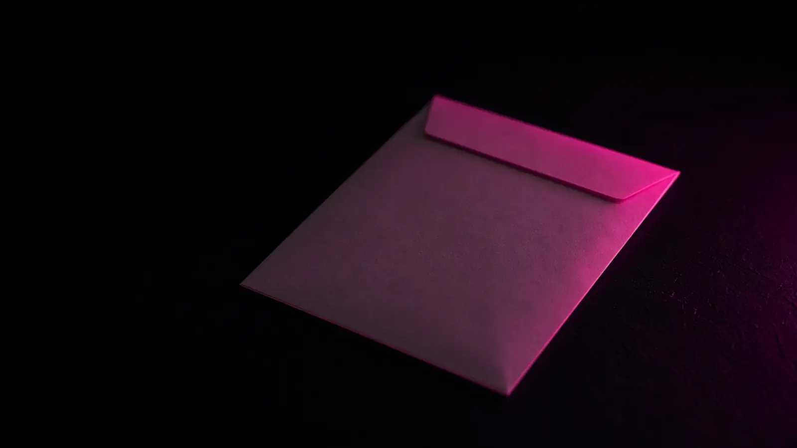 A single envelope on a dark desk catching a hot pink edge light, Massachusetts data breach notification requirements