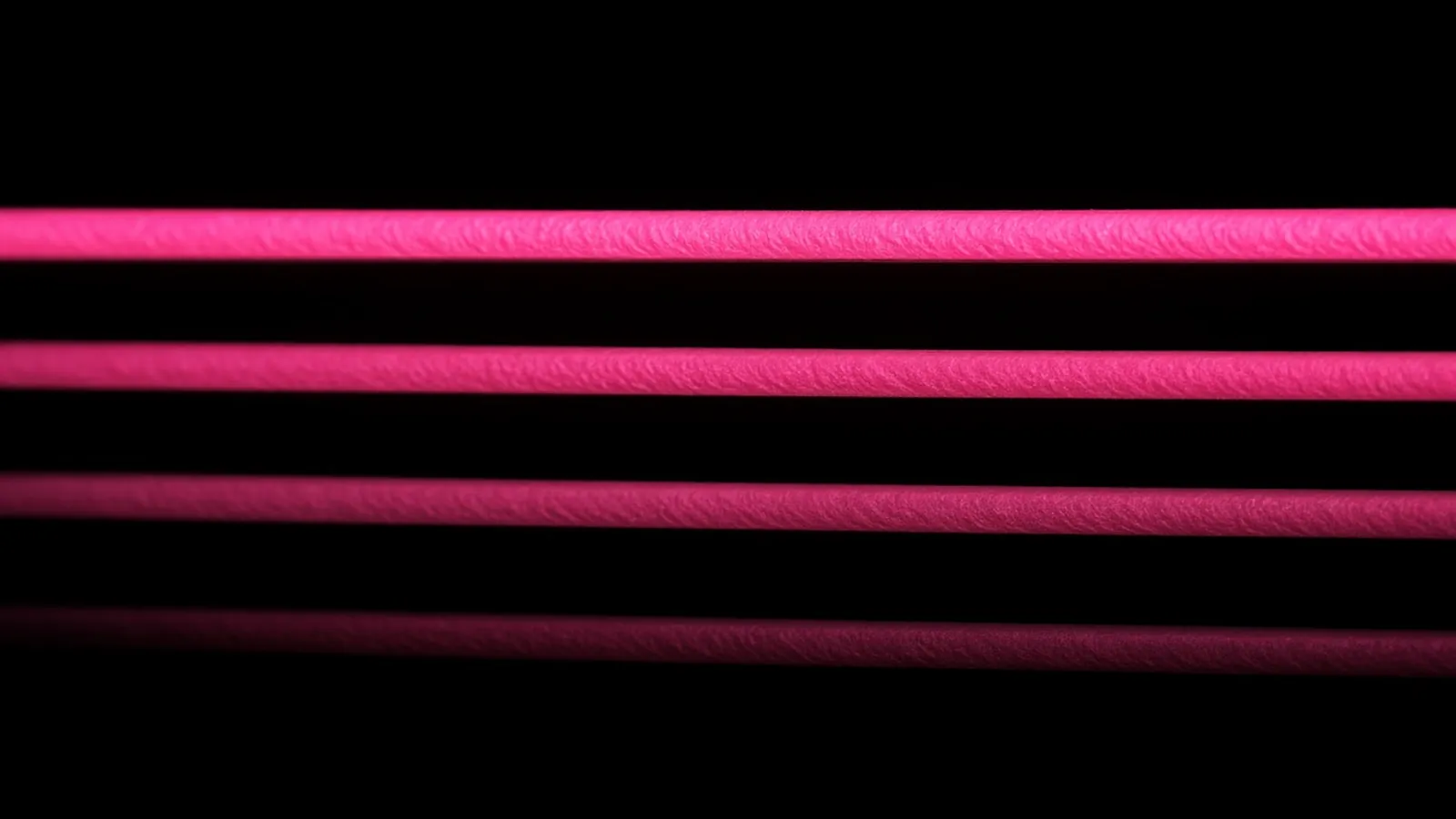 Four magenta bands of decreasing brightness on black, severity tiers in an MSP SLA
