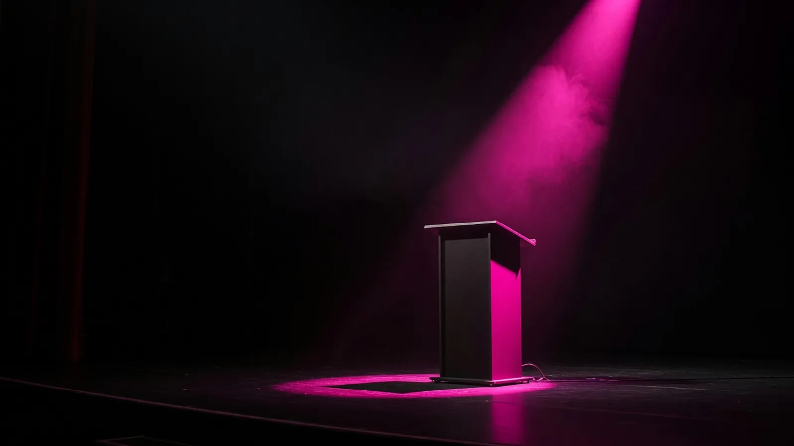 A magenta scorecard in front of a dark demo stage, partner vetting before the pitch