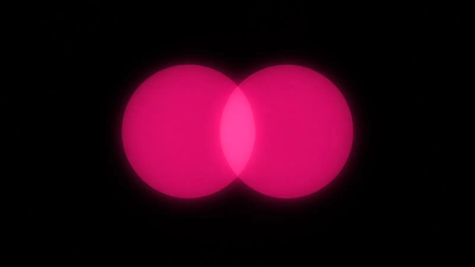 Two magenta light fields overlapping on black, the shared zone brightest, protecting proprietary data with vendors