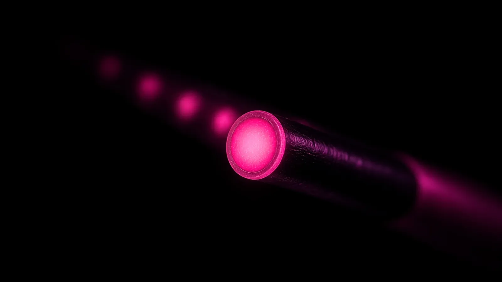 A magenta thread ending cleanly against dim residual traces on black, retention and exit in vendor data protection