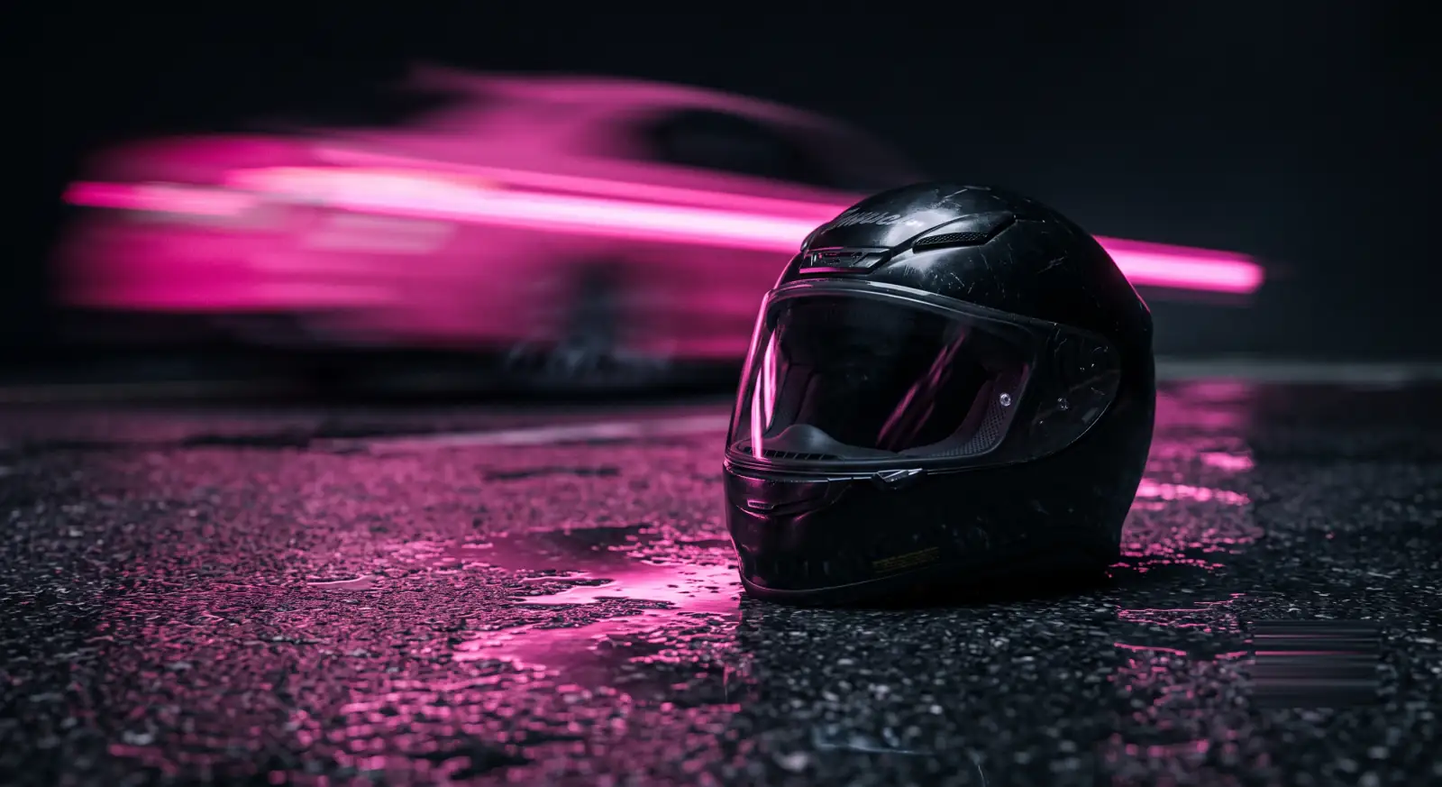 A motorcycle helmet on wet asphalt with a speed streak, illustrating risk compensation