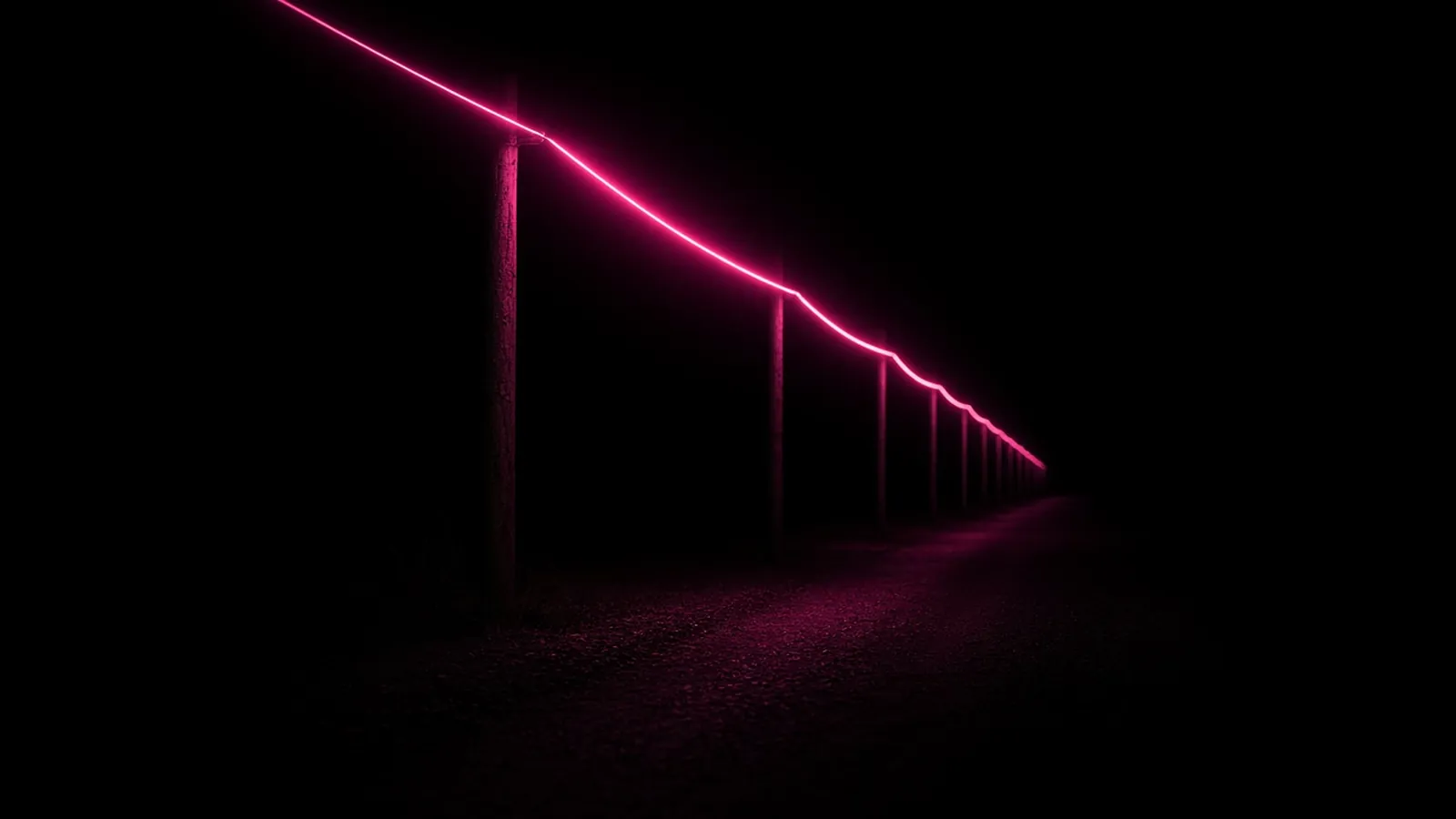 A row of dark utility poles at night with one strand of cable glowing hot pink between them, municipal fiber in Shrewsbury, Massachusetts