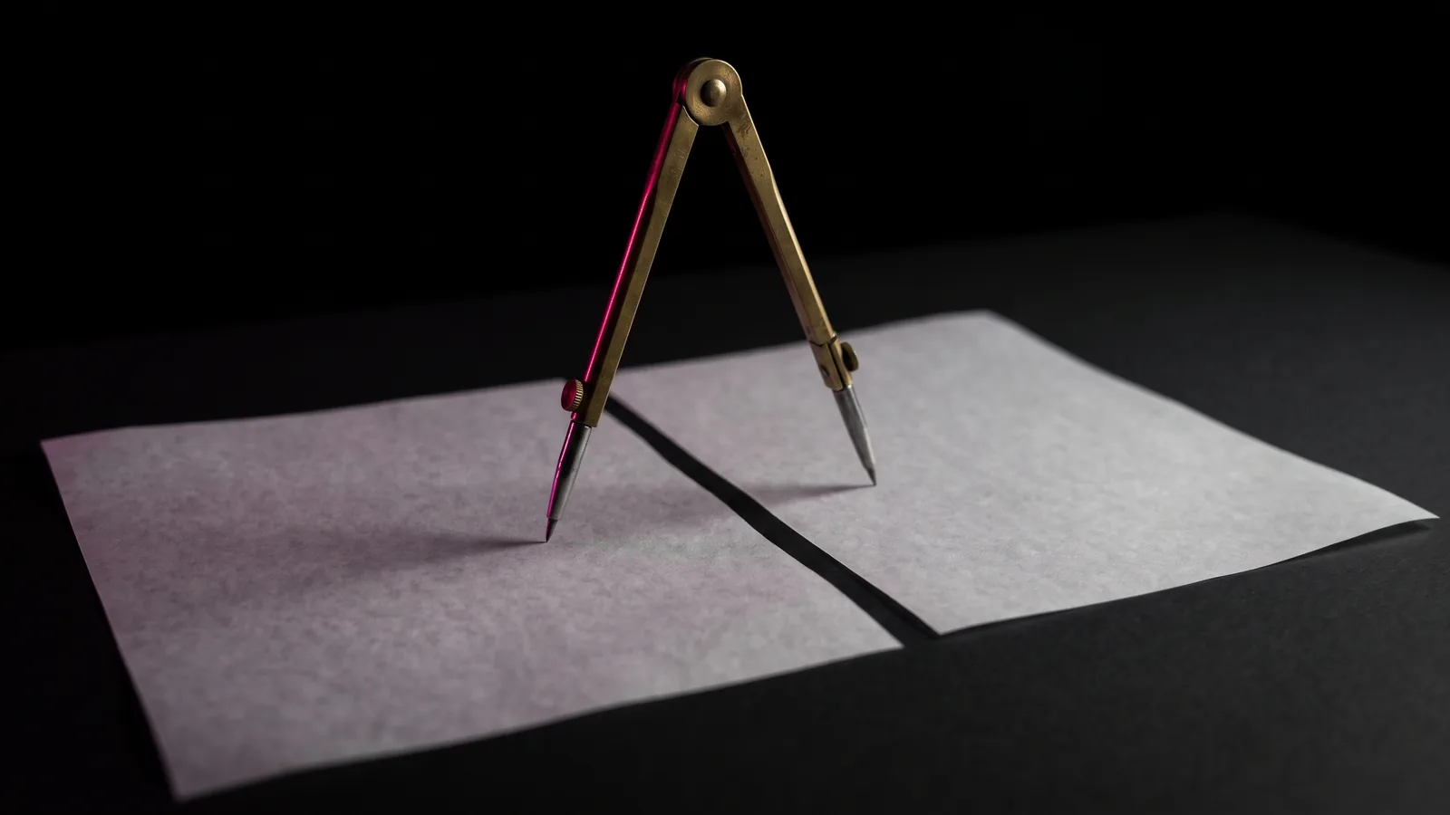 Brass drafting dividers spanning two blank vellum sheets on black, one point lit hot pink, measuring two quotes