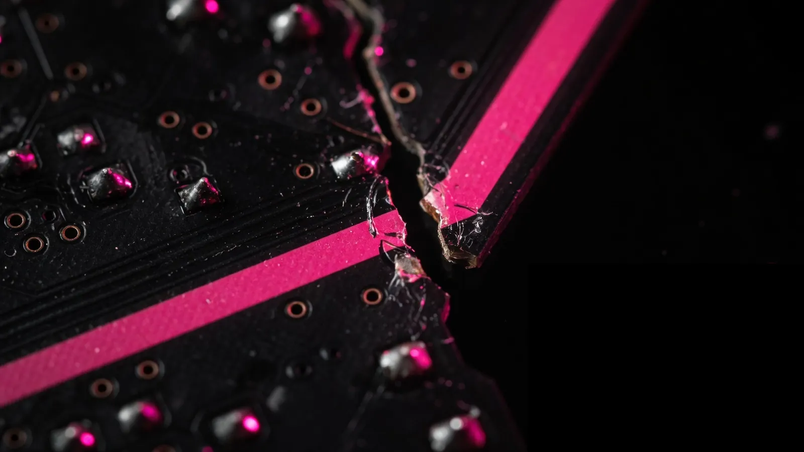 Broken magenta circuit trace on black, technology stack fragmentation at vendor boundaries