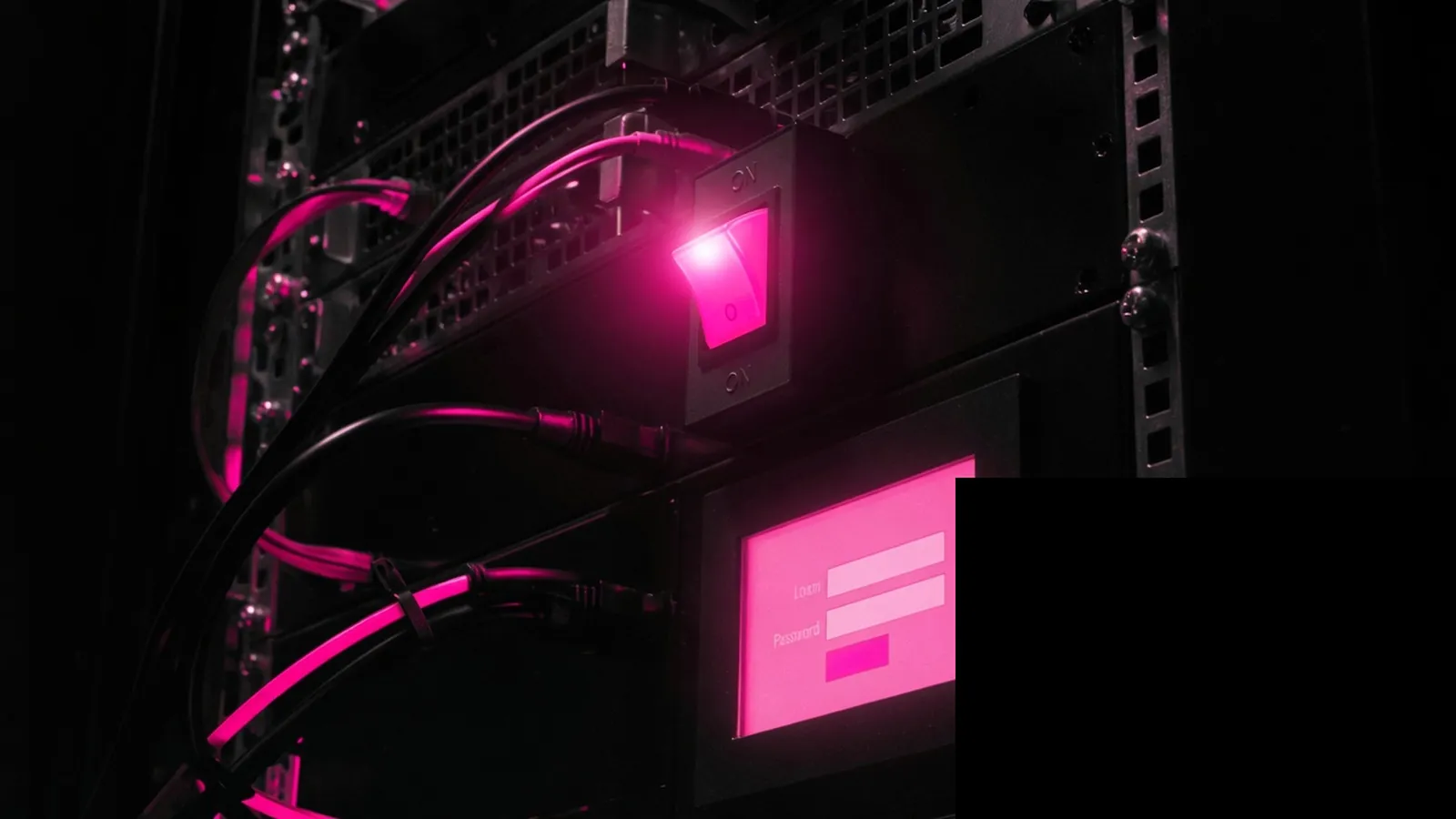 A magenta night-shift switch on a dark rack, retainer holds the operational login